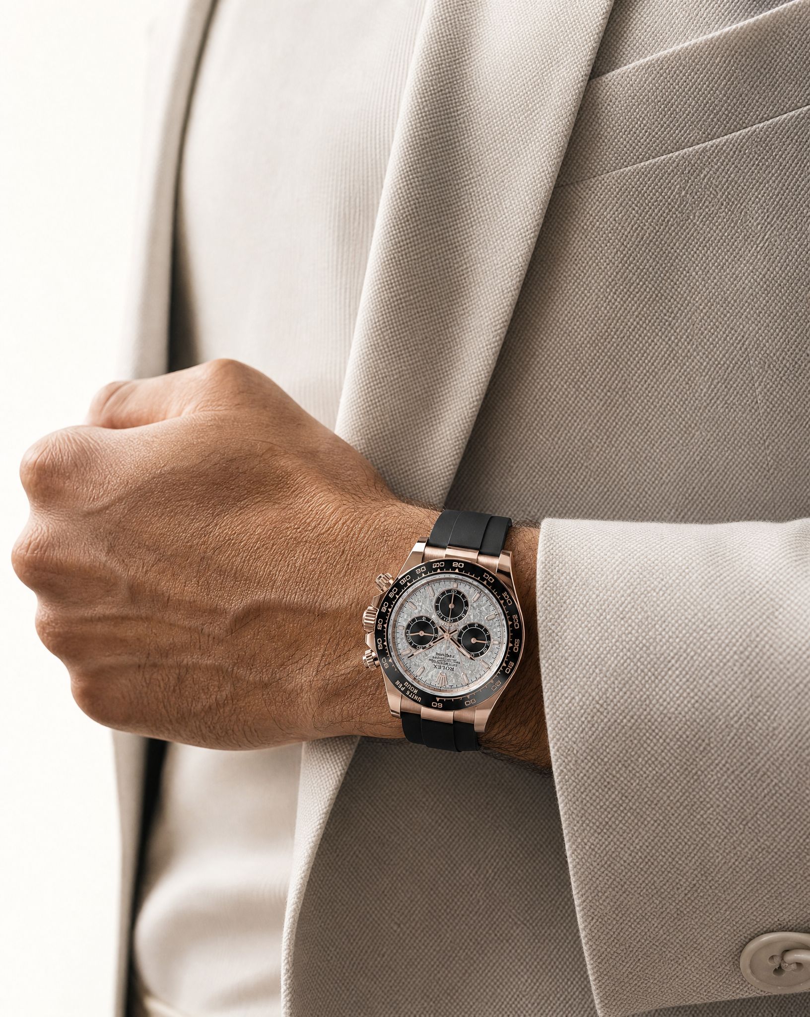 A rose-gold chronograph worn with tailored neutrals